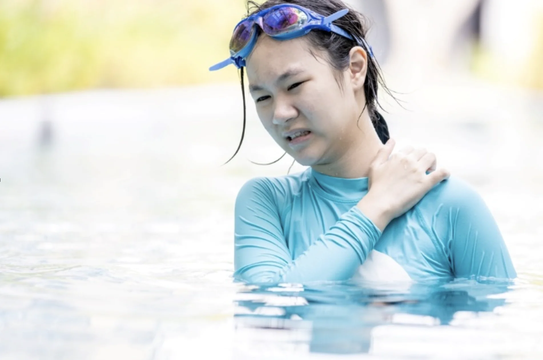 Swimmer experiencing skin irritation during summer
